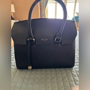 Italian pebble, leather satchel with double handles and shoulder strap.